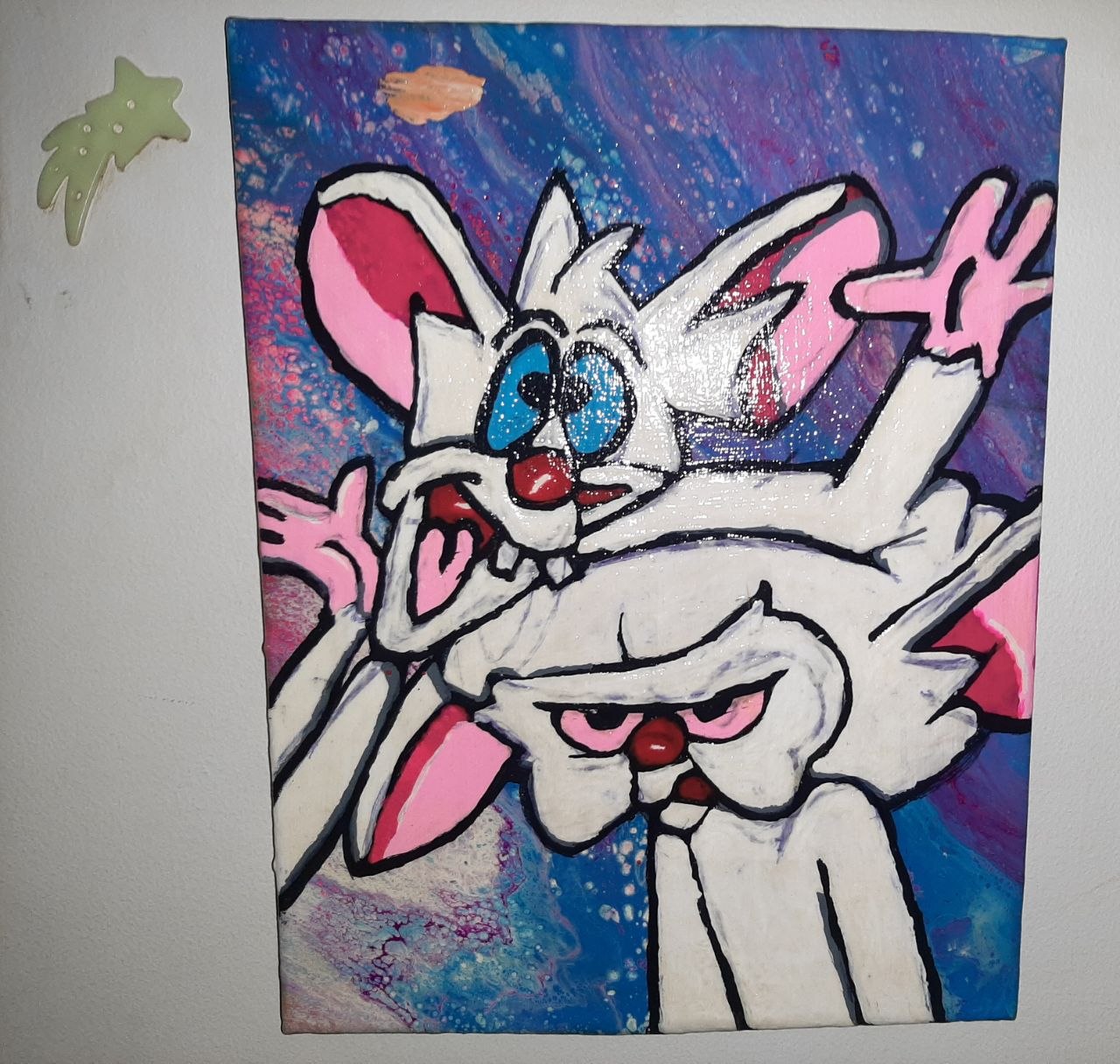 Freehand drawing of Pinky and the Brain on a galaxy-fluid background, painted on canvas