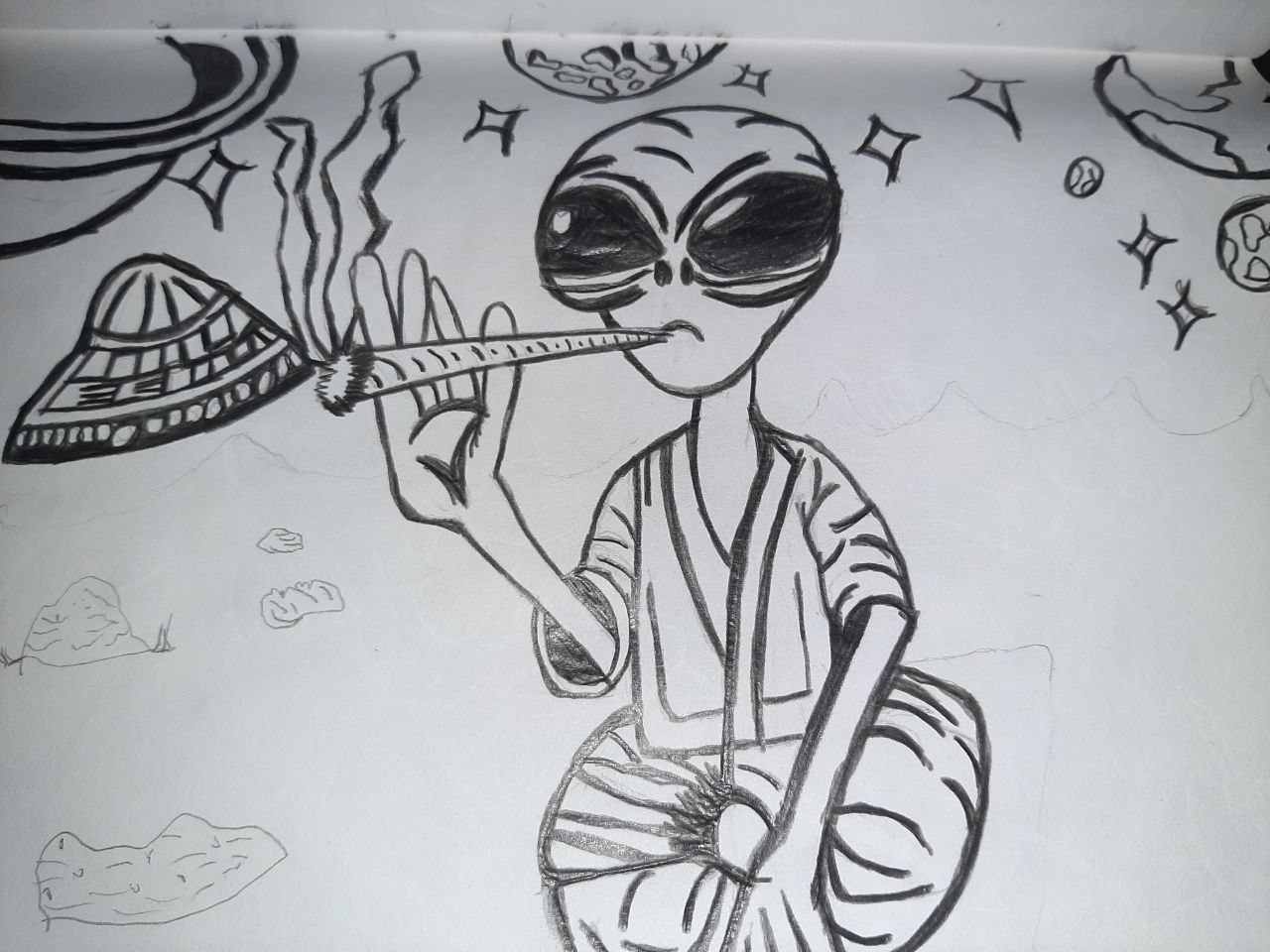 Freehand pencil sketch of a grey alien in striped robe smoking a joint in space with a ringed planet, UFO and rocks