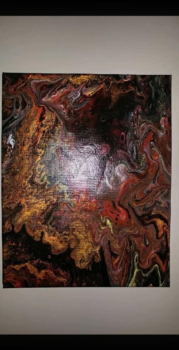 Untitled dark red/orange/black fluid art with silver center